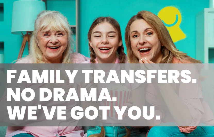 Three generations of women – grandmother, mother, and daughter – smiling together on a couch in a bright living room. The young girl holds a box of popcorn. White overlay text reads “Family Transfers. No Drama. We’ve Got You."