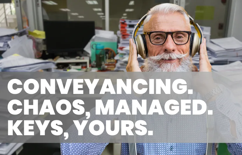 Smiling man with headphones in an office full of paperwork, with text overlay reading Conveyancing. Chaos, managed. Keys, yours.