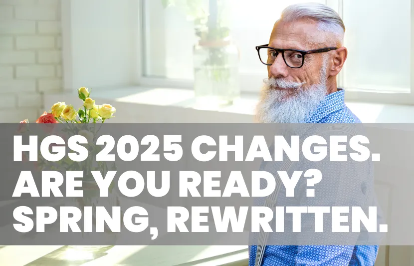 Older man with white beard, glasses, and a blue patterned shirt sits indoors at a table with flowers, glancing back over his shoulder with a slight smile. Sunlight streams through a window behind him. White overlay text reads “HGS 2025 Changes. Are You Ready? Spring, Rewritten.”